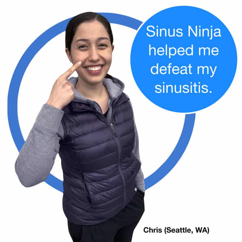 Smiling woman from Seattle Washington pointing to her nose saying Sinus Ninja helped me defeat my sinusitis